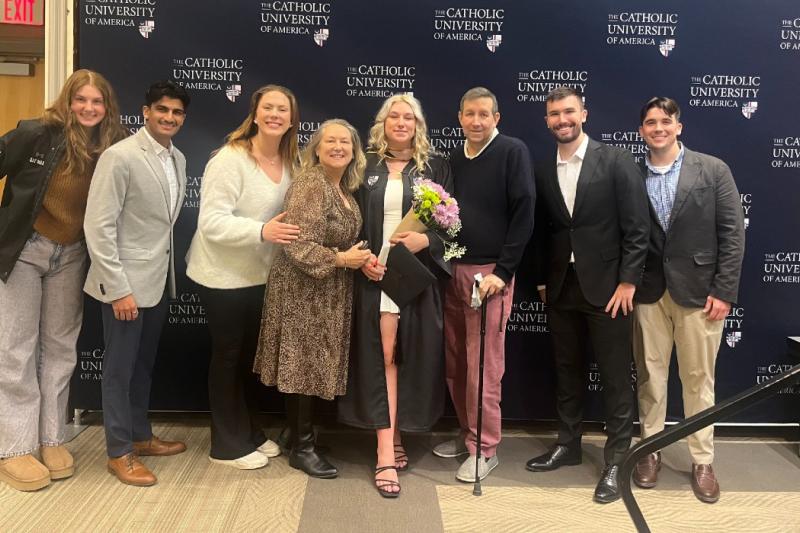 lauren at graduation with friends and family