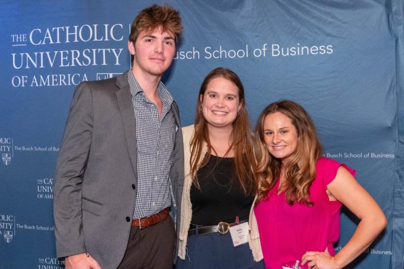 michael with friends at a busch school sales networking event