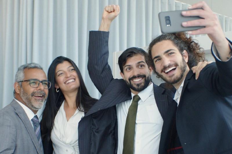 young business professionals taking a selfie