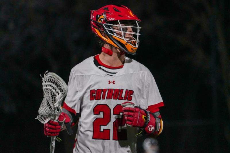 victor playing lacrosse on the CUA men's team