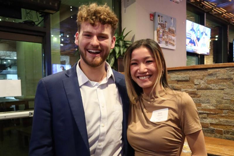 zachary and a friend at a business school social event