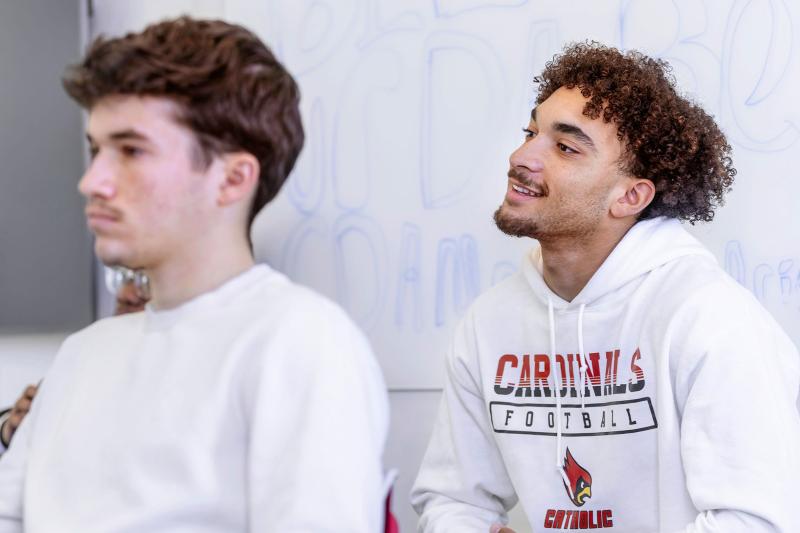 Students listening to a professor.