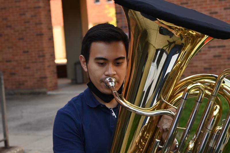 young man playing a tuba