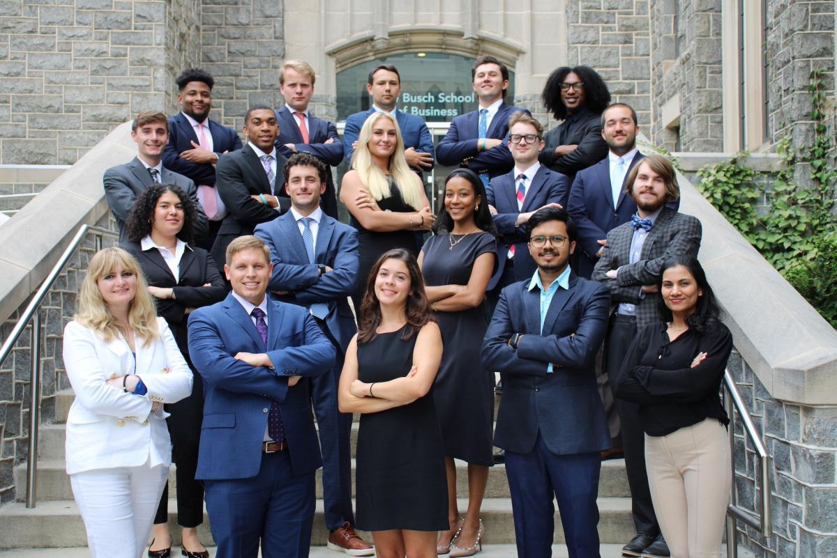 Busch school students in business attire on the busch school steps