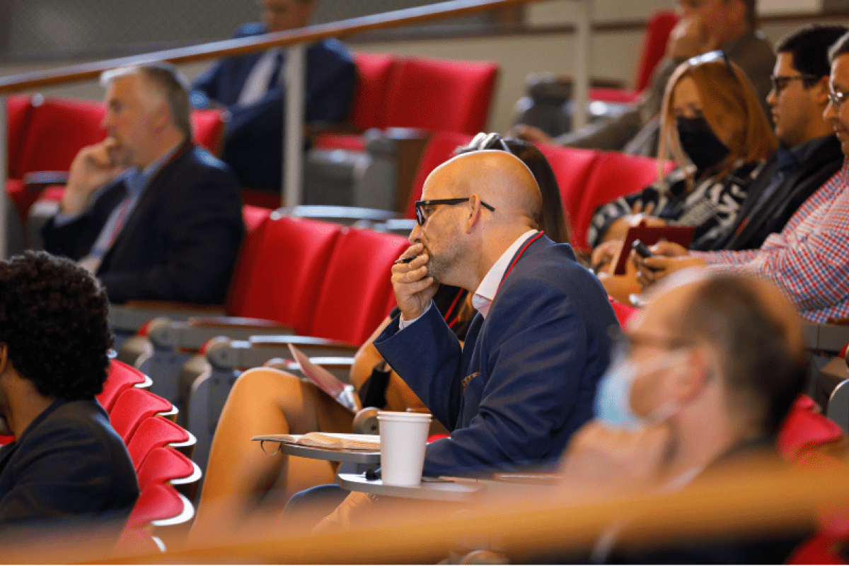 people listening to a speaker at the family business consortium