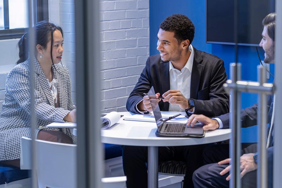 Business students in a meeting room.
