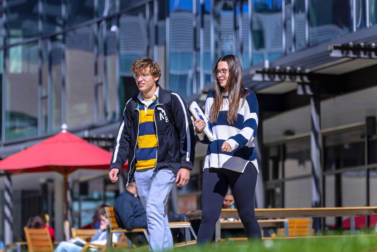 Two students walking near the Pryz.