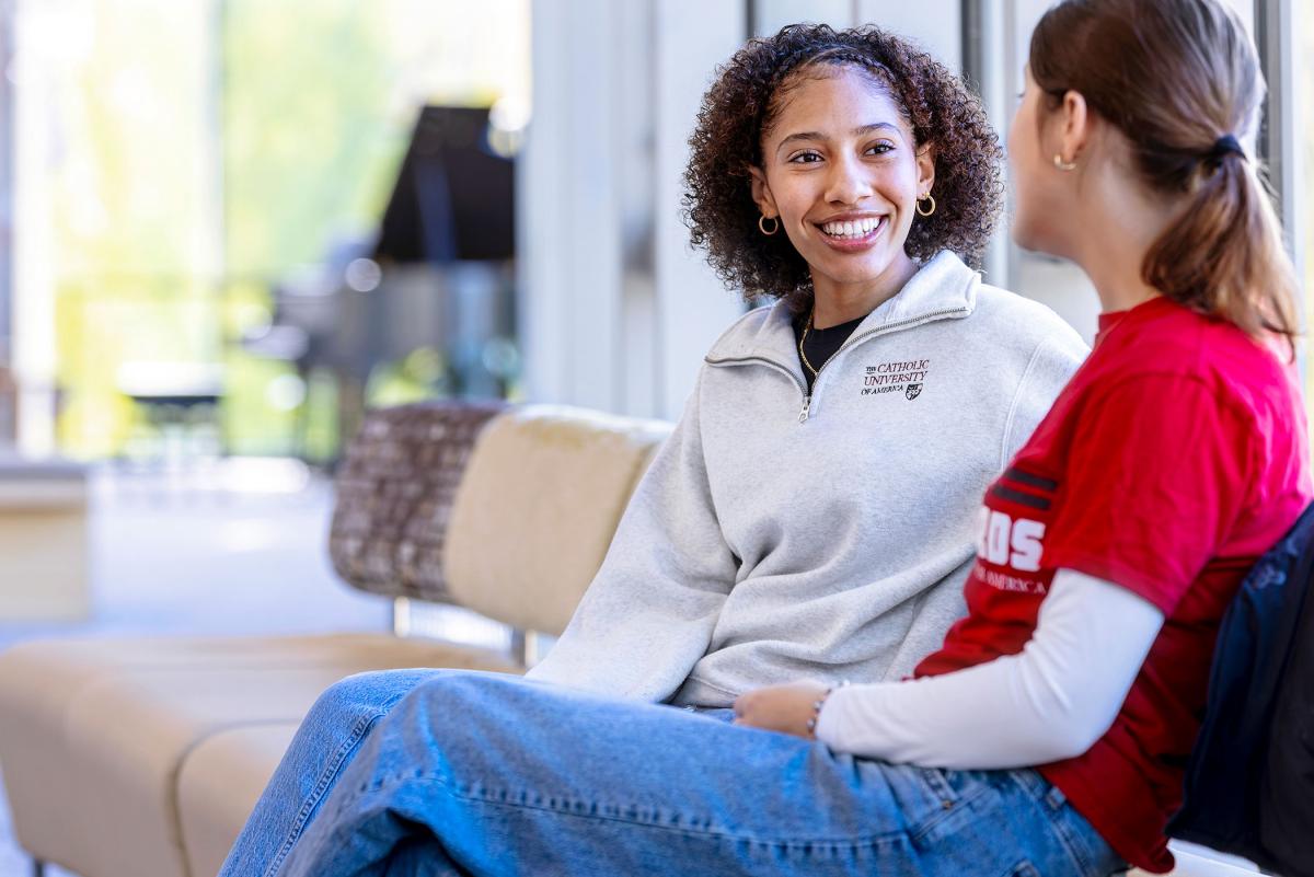 Two students talking in the Pryz.
