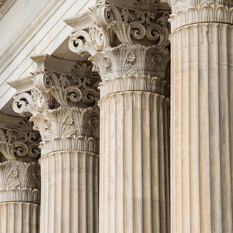 A row of marble institutional columns.