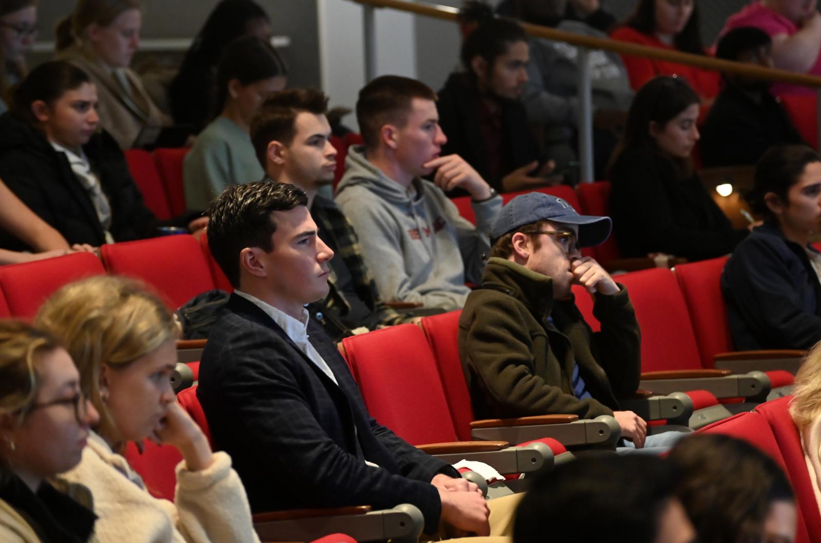 students paying attention to a talk in a lecture room