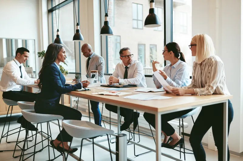 group of professionals collaborating at a table